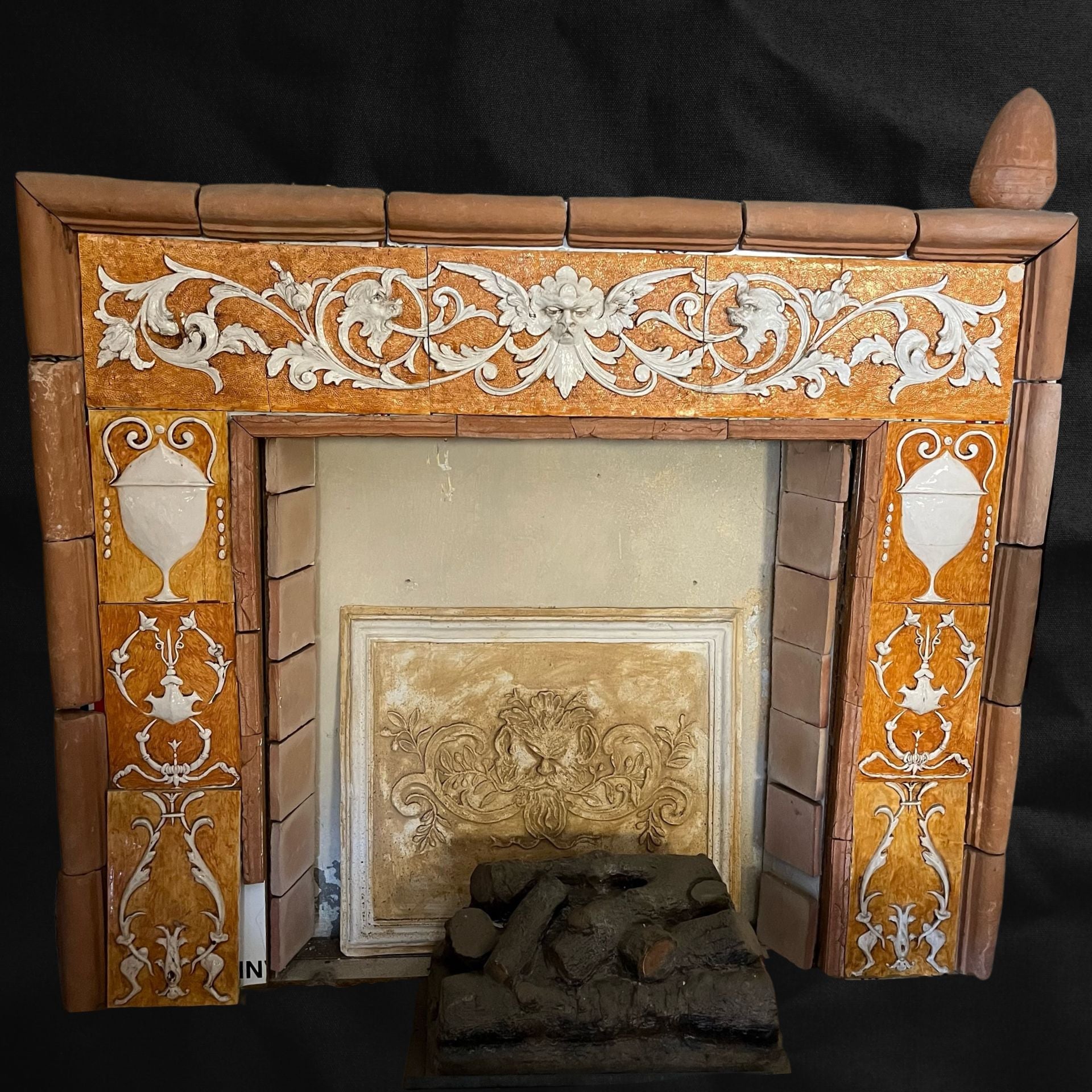 Majolica relief covering for fireplace